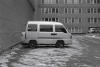 Cute grey van parked in a parking lot.